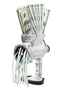 Money concept. Dollars are milled in meat grinder